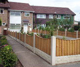 F03 - Concrete Slotted Posts, Rock Faced Gravel Boards and 6ft x 2ft Concaved Feather Edge Fence Panels