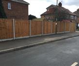 6ft High Premium Feather Edge Fencing with Concrete Posts and Rockfaced Gravel Boards