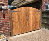 Arched matchboard gates and posts fitted in Trowell.