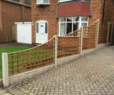 Concaved Square Trellis with Concrete Posts and Rock Faced Gravel Boards