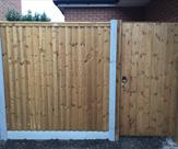 Fencing and matchboard gate with key lock fitted in Sawley.