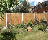 Fencing stepped to suit the run of garden.