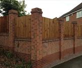 Closeboard fencing in-between brick pillars