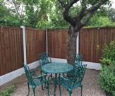 6ft high fencing in a nice cosy corner of the garden.