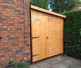 Pent shed with door on end fitted in Arnold.