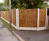 F52 - Corner Fencing with Feather Edge Panels, Concrete Slotted Posts and Rock Faced Gravelboards