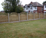 F53 - Omega Lattice Panels with Concrete Posts and Gravelboards