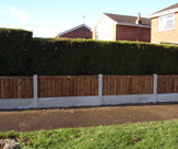 F58 - 3ft high fencing with 6ft x 1ft smooth gravel boards and 6ft x 2ft premium feather edged fence panels.