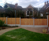 F17 - Convexed Feather Edged Fence Panels with Rock Faced Gravel Boards