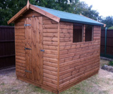 SS44 - Loglap Shed with Kerabit felt, toughened glass and timber base.